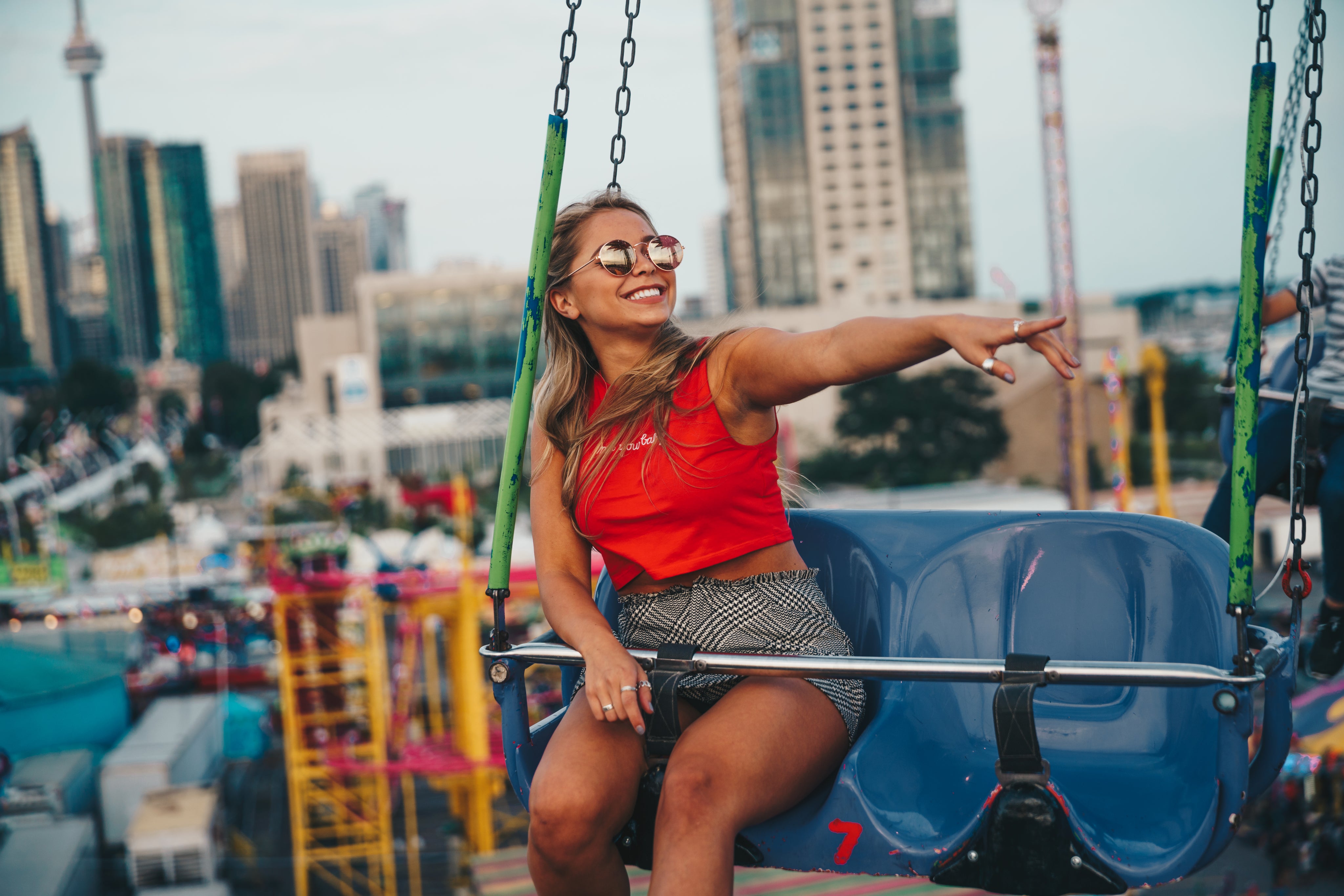 files/young-woman-smiling-on-swing-ride.jpg